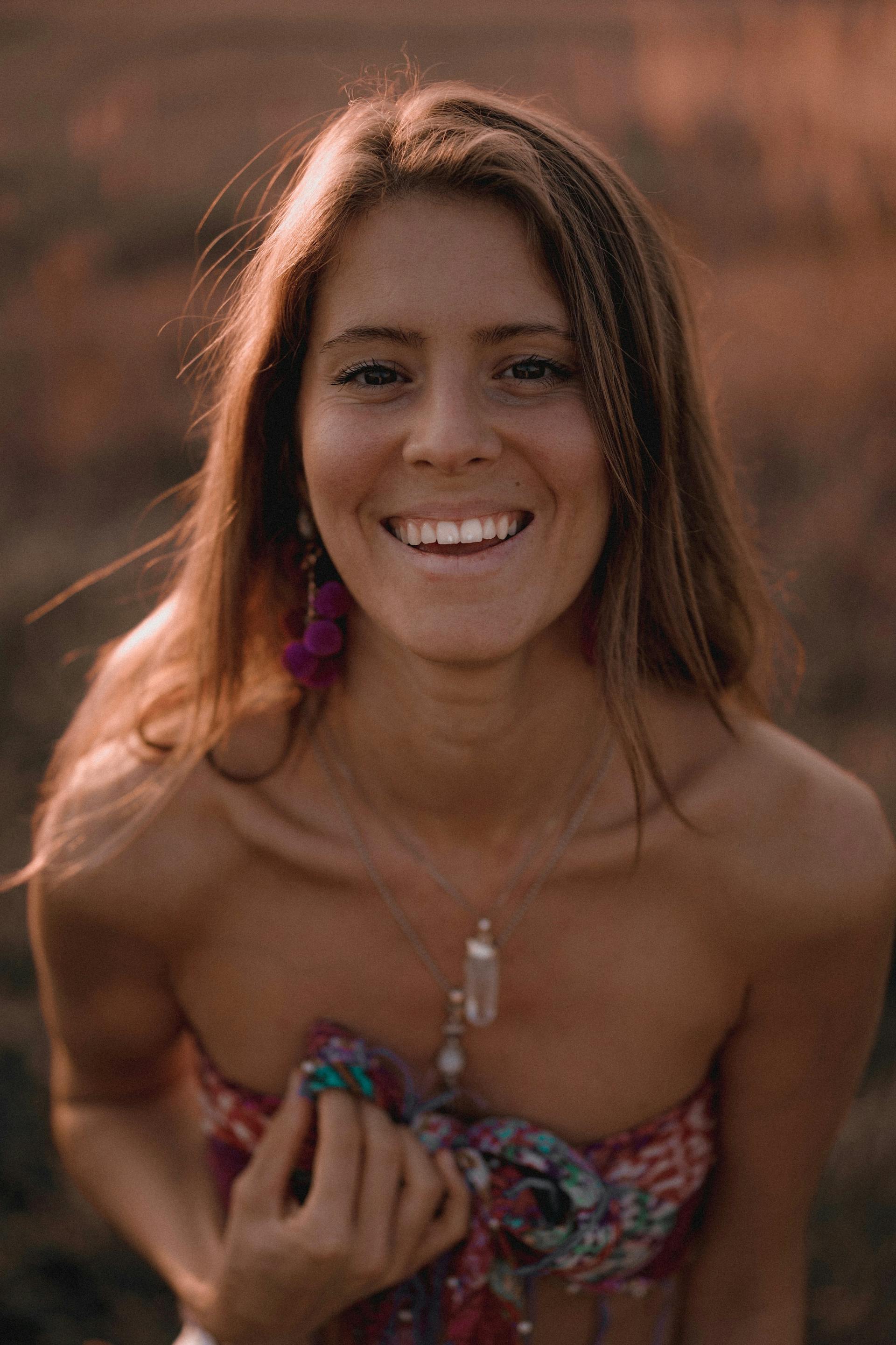 Portrait of woman smiling in golden light
