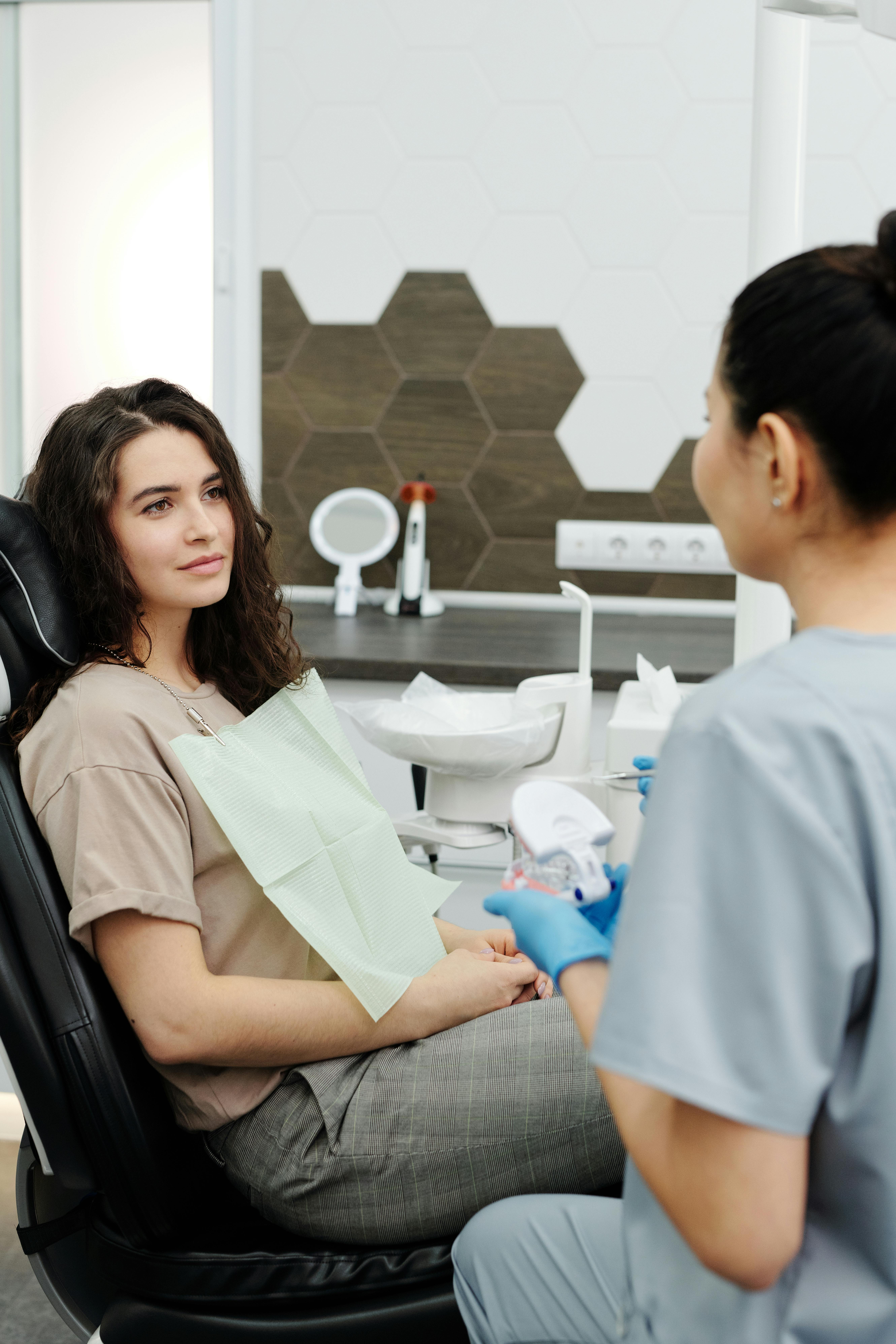 Patient in the dental chair during a relaxed consultation with their clinician