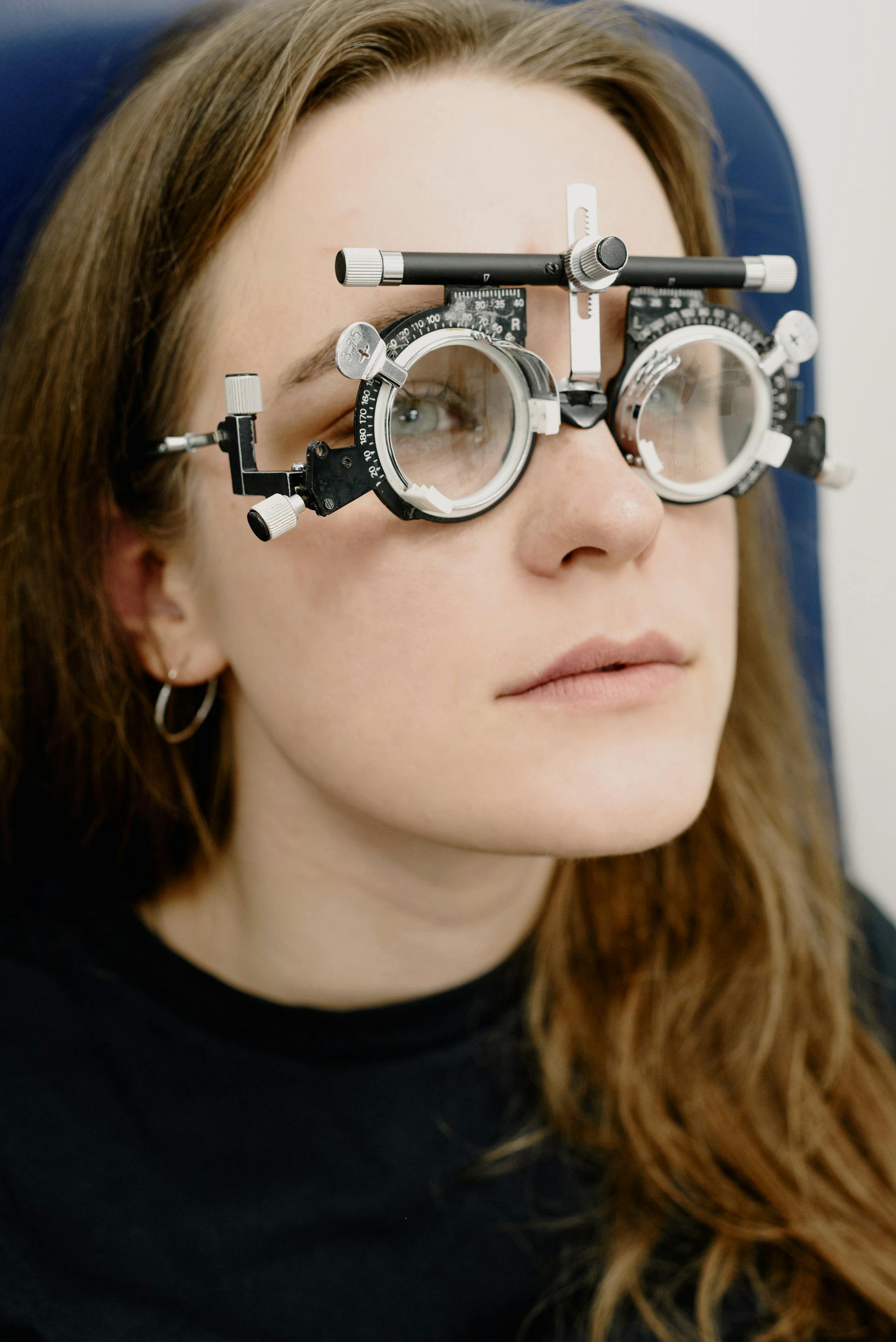 Optician performing a detailed eye examination