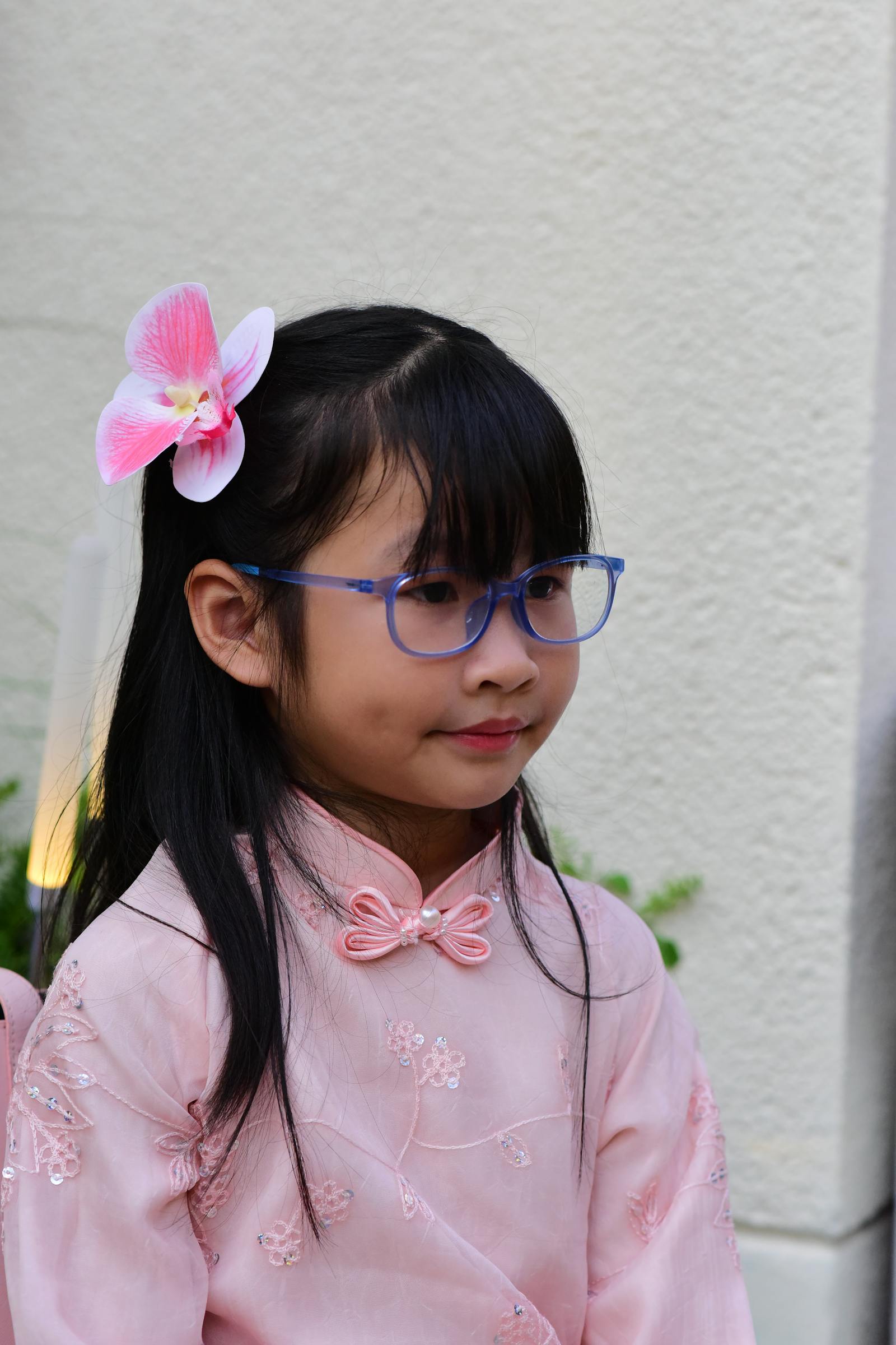 Child wearing glasses, natural light